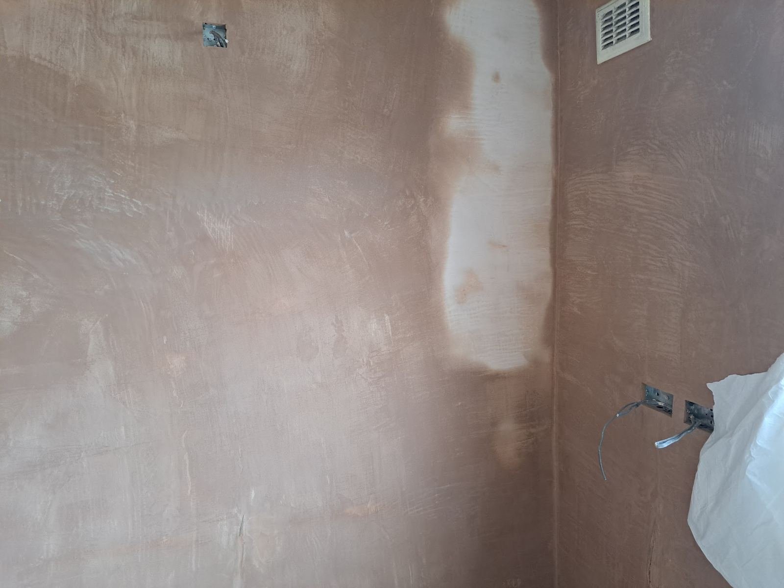 Wall plastered after a chimney breast was removed